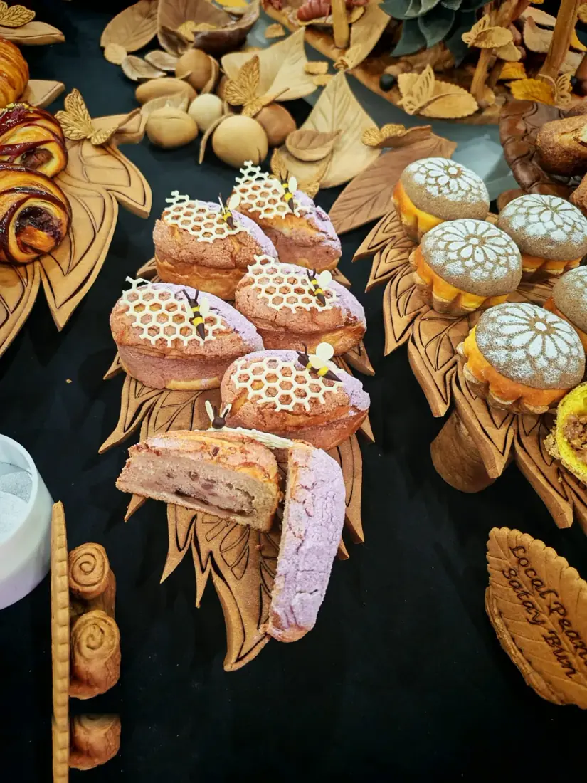 Honeycomb-topped buns with chocolate bee decorations by Chef Terry