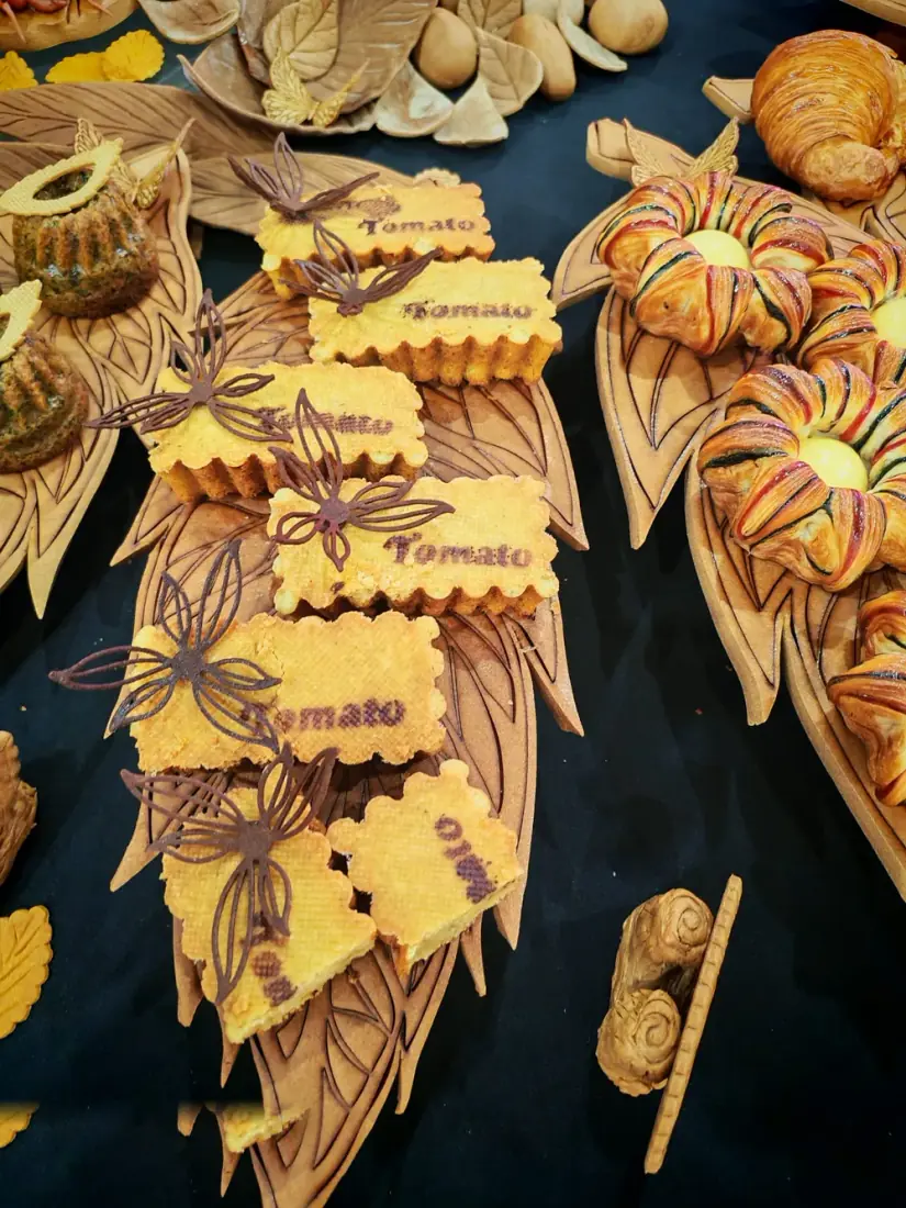 Decorated tomato sable cookies with chocolate butterfly accents by Chef Terry